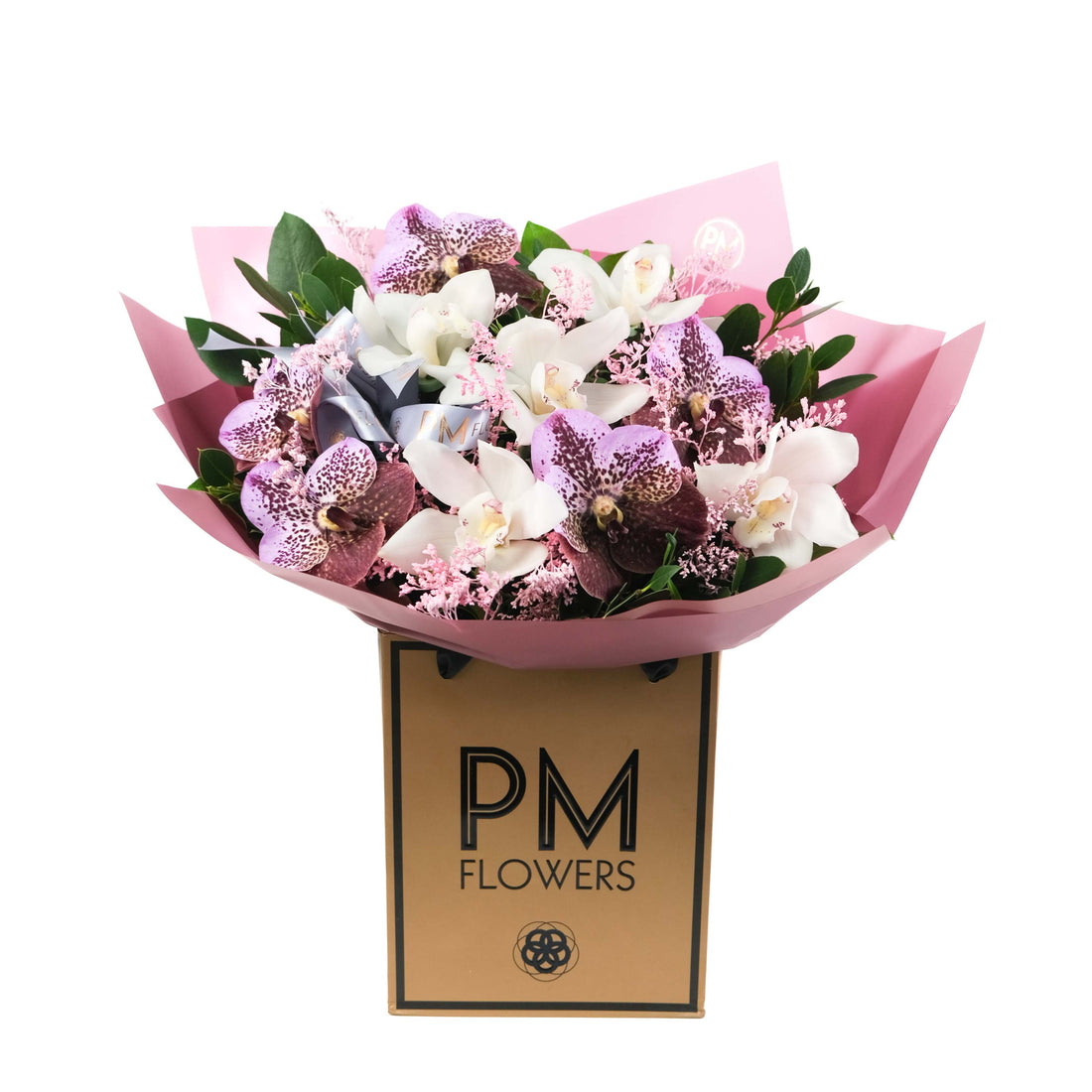 Bouquet of flowers wrapped in pink paper with &