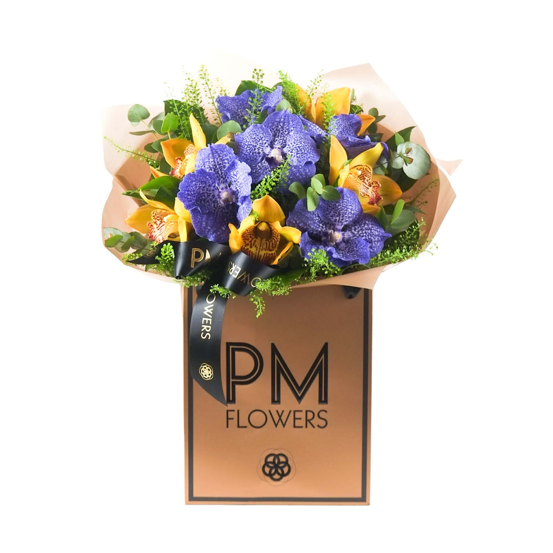 A bouquet of flowers with a mix of blue and yellow orchids, wrapped in a Rose Gold Cello with a branded label that reads &