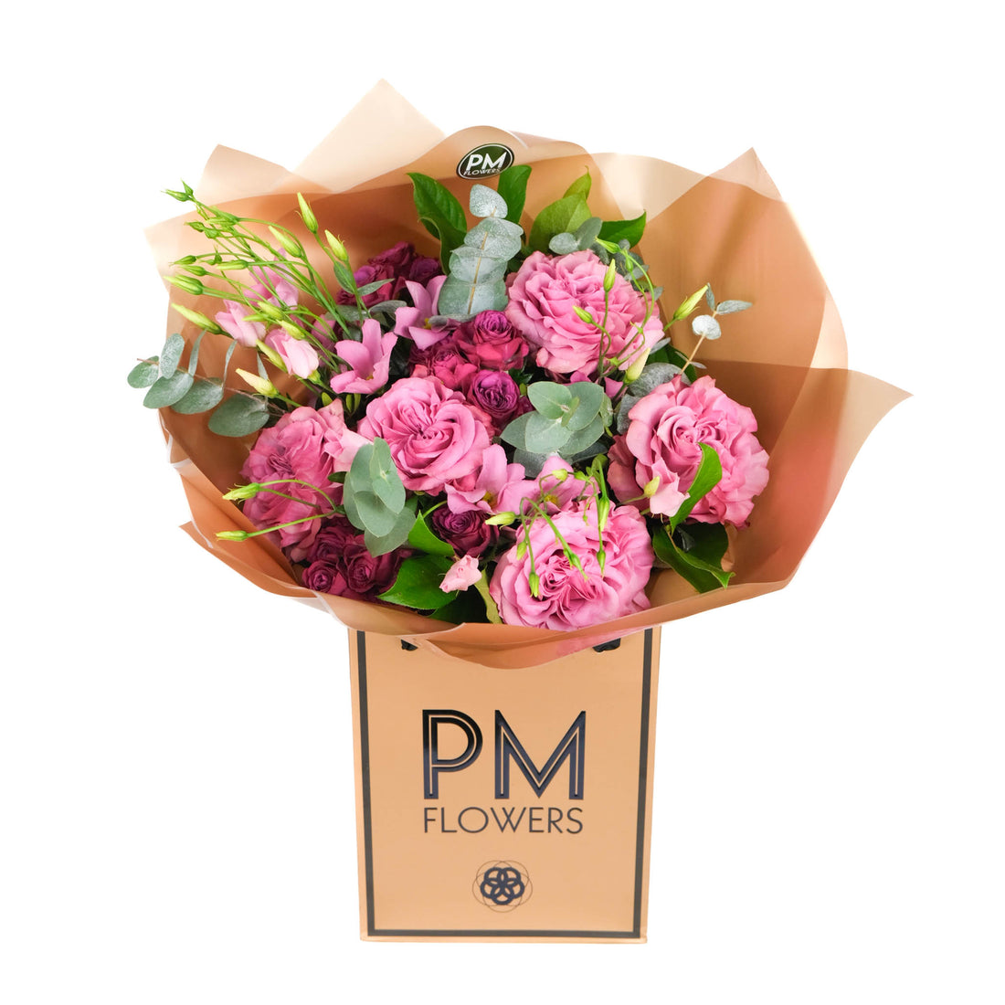 A bouquet of cerise pink and rich purple flowers, including large-headed roses and lisianthus, wrapped in brown paper with &