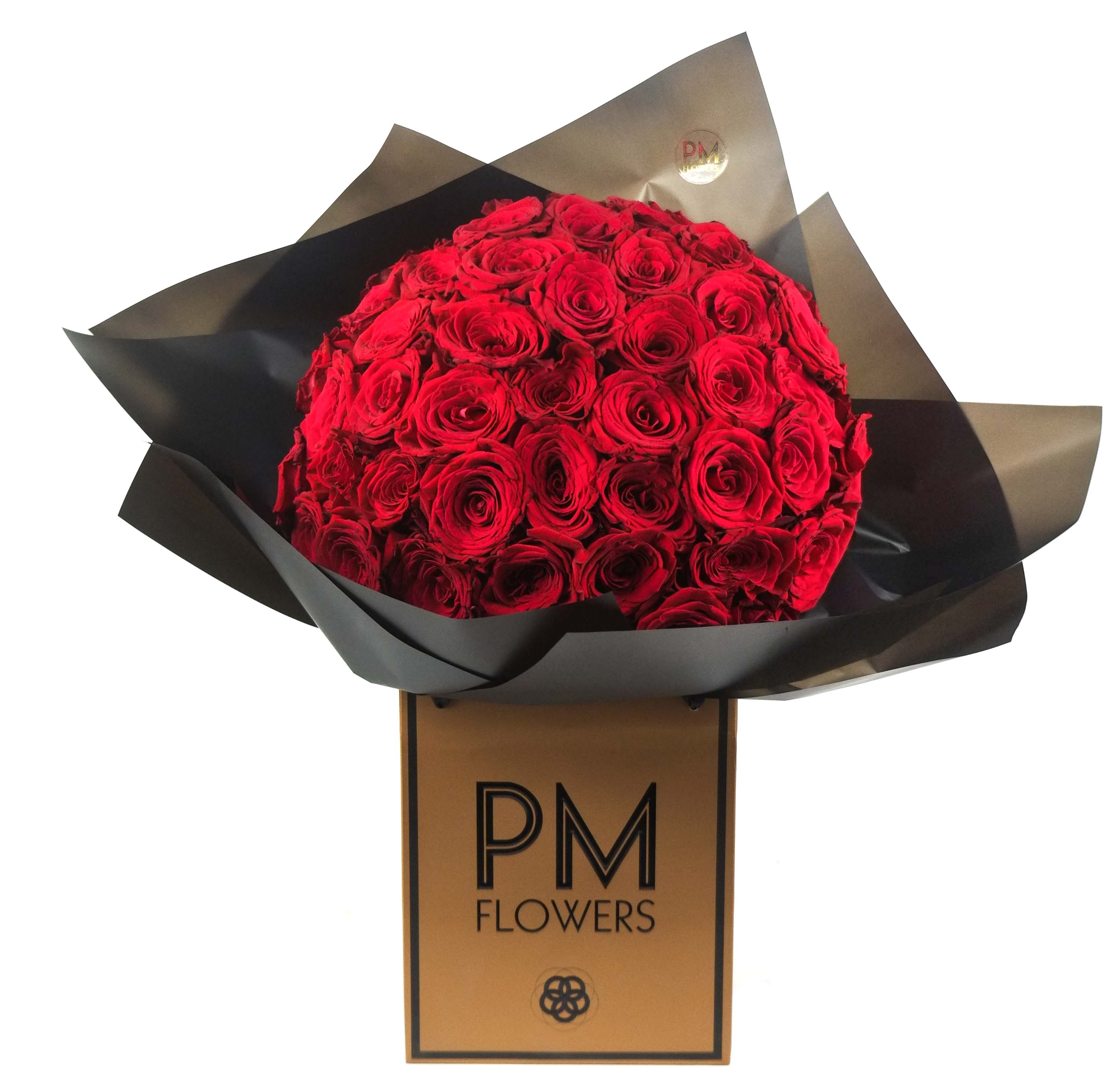 A bouquet of 50 deep red roses arranged neatly in a square box with a brand logo &