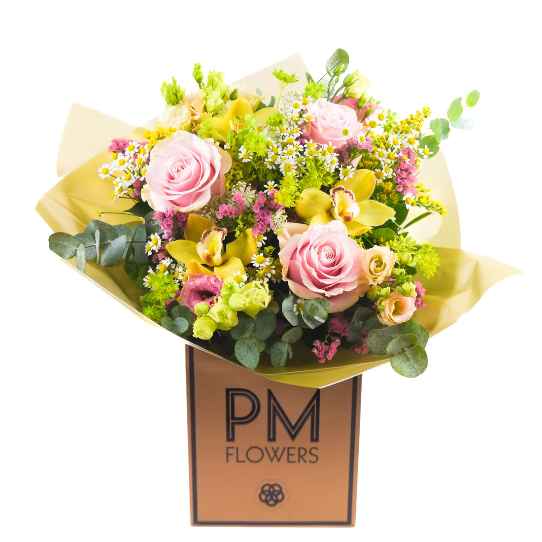 A freshly arranged floral bouquet with large dusky pink roses, orchids, and other summer flowers, wrapped in yellow and green paper with &