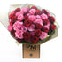 A bouquet of pink, red, and purple roses arranged 