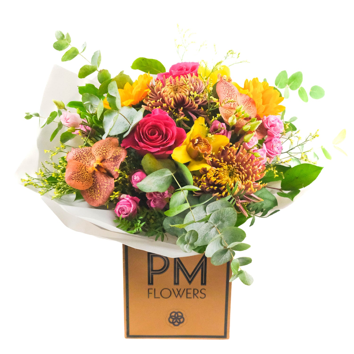 A colorful bouquet of assorted flowers including sunflowers, roses, and orchids, wrapped in paper with &