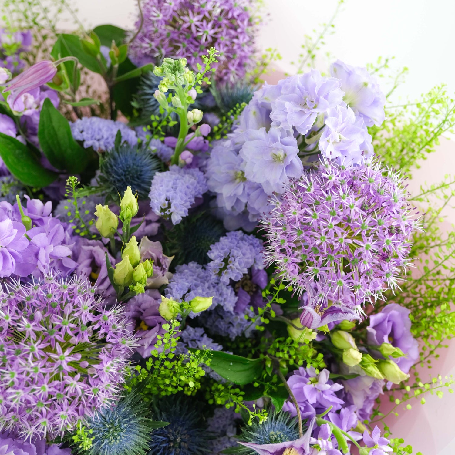 Bouquet of purple and green flowers with a soft focus background
