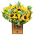 A vibrant bouquet of sunflowers, yellow spray roses, and various other flowers with green foliage, presented in a brown paper wrap with &